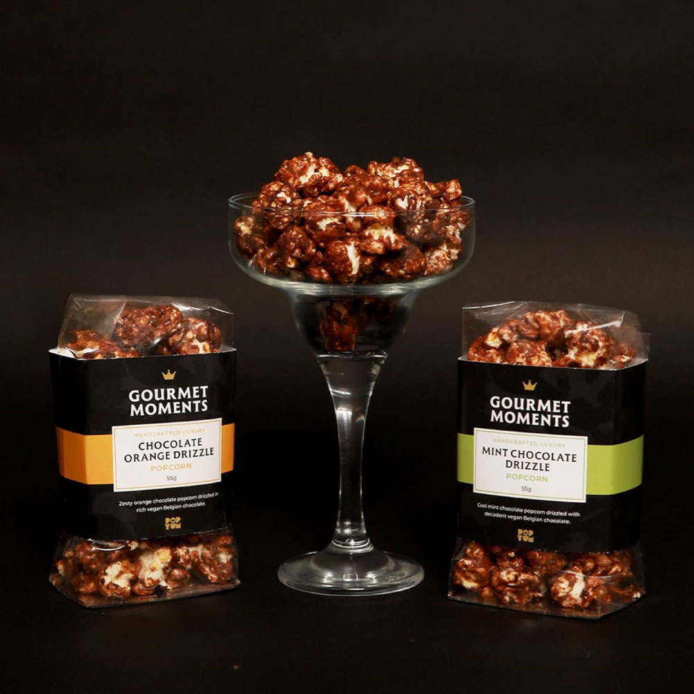 Premium popcorn packaging design for Gourmet Moments, featuring Chocolate Orange and Mint Chocolate flavours in a luxury food brand style by Creative Footing.