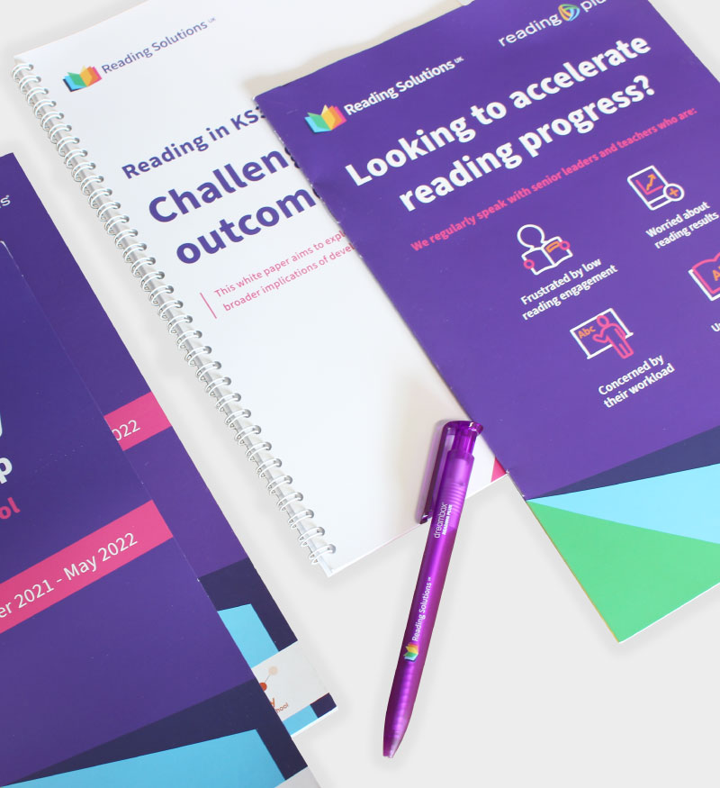 Branded print materials for Reading Solutions UK, including custom-designed reports, brochures, and stationery. Graphic design by Creative Footing.