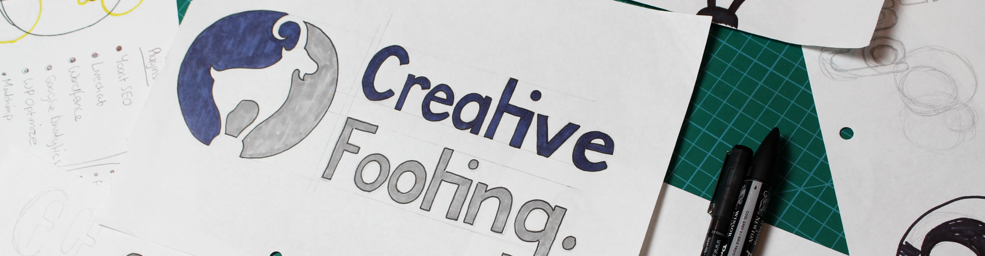 Sketches of Creative Footing logo concepts, showing the early stages of brand identity development.