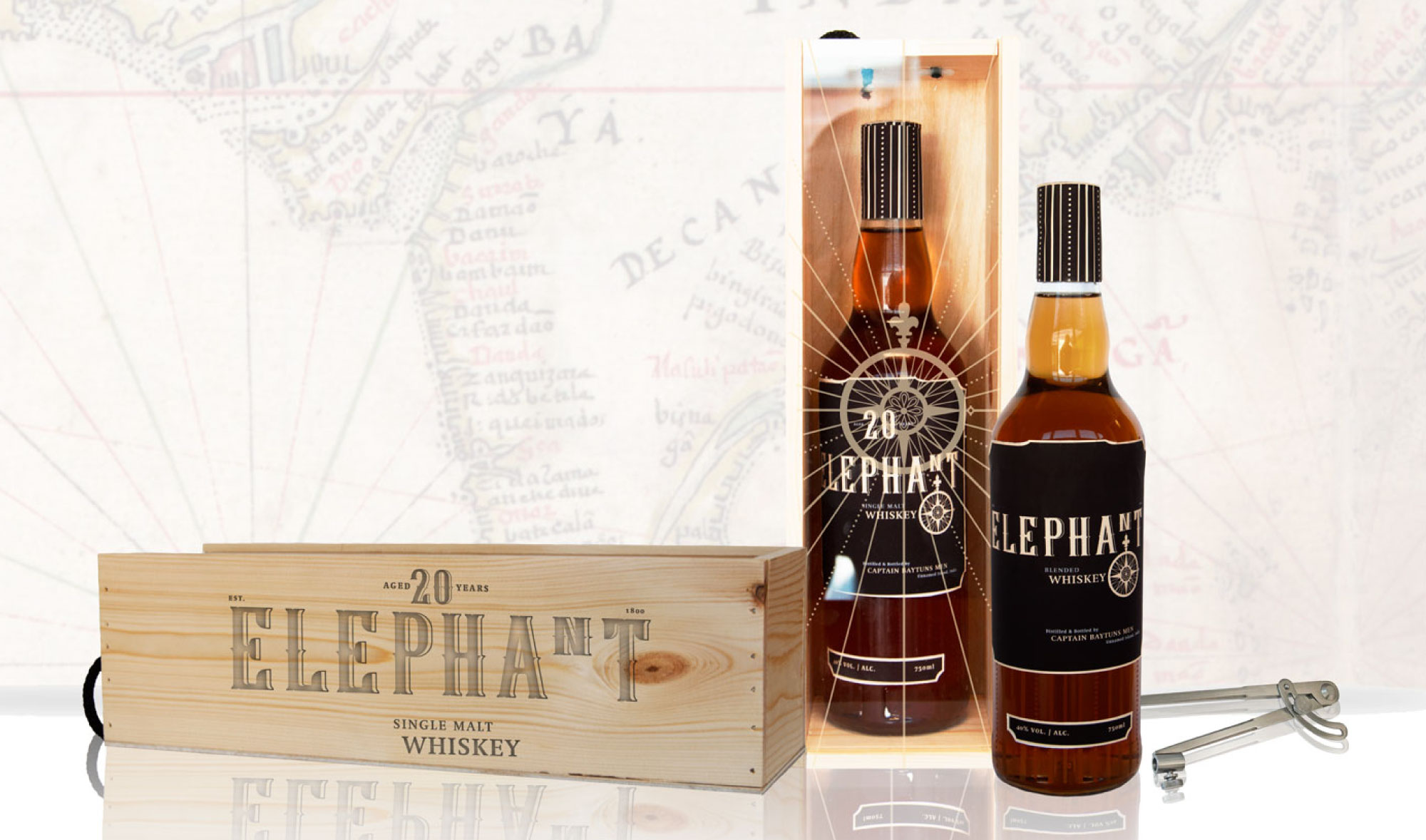 Bottle mock-up for Elephant Whiskey, featuring vintage-inspired labels and a background map evoking 19th-century sea life. Designed by Creative Footing.